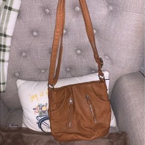 BRAND NEW Bueno crossbody bag. Faux leather with lots of zippers and pockets.